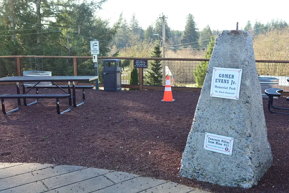 Memorial pillar and picnic area at Gomer Evans Jr. Memorial Park in Black Diamond, Washington