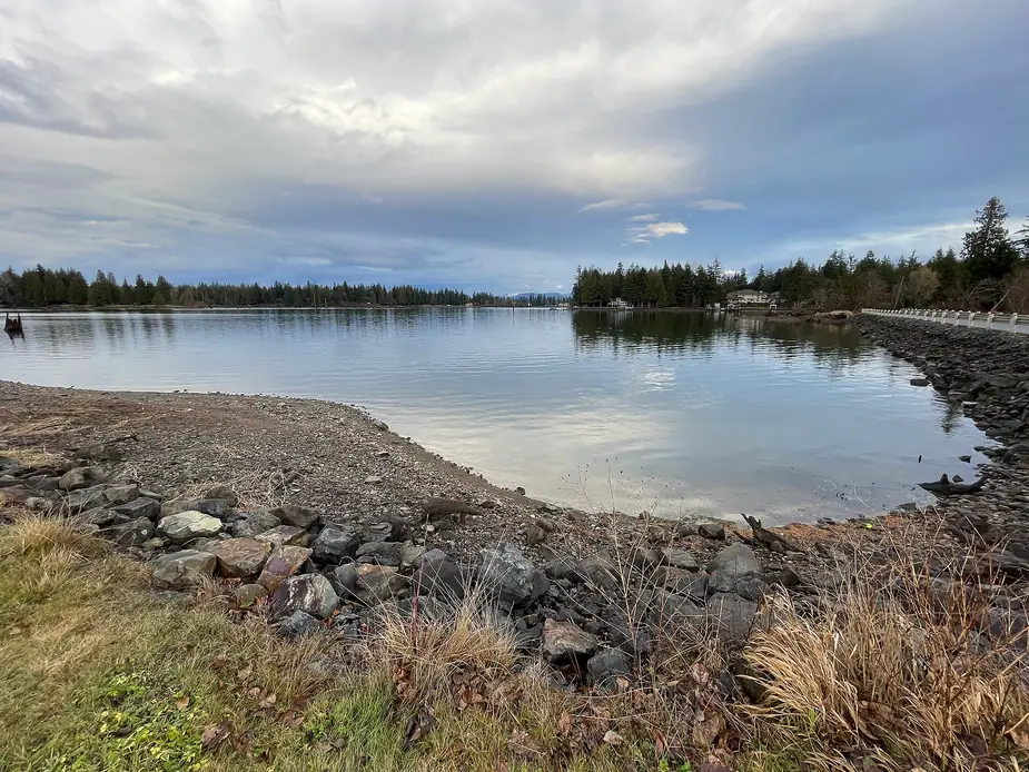 The water and wooded shoreline of Lake Tapps in Pierce County, Washington