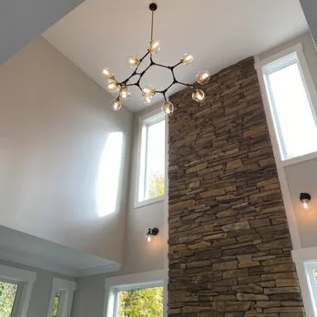 Statement chandelier installed in a two-story great room