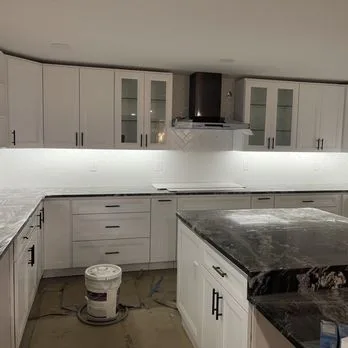 Finished kitchen remodel with under-cabinet lighting and range hood circuit